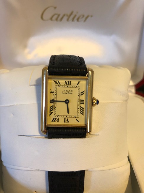 Cartier Gold W/Black Alligator Band. Blue Dial. Black Roman Numerals Tank Solo Small Watch Cartier Gold W/Black Alligator Band. Blue Dial. Black Roman Numerals Tank Solo Small Watch