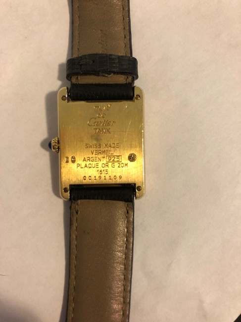 Cartier Gold W/Black Alligator Band. Blue Dial. Black Roman Numerals Tank Solo Small Watch