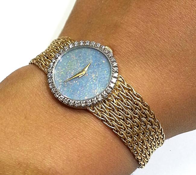 Baume & Mercier 18 Karat Yellow Gold with 36 Diamonds 0.75 Ct.tw. Opal Dial Watch Baume & Mercier 18 Karat Yellow Gold with 36 Diamonds 0.75 Ct.tw. Opal Dial Watch